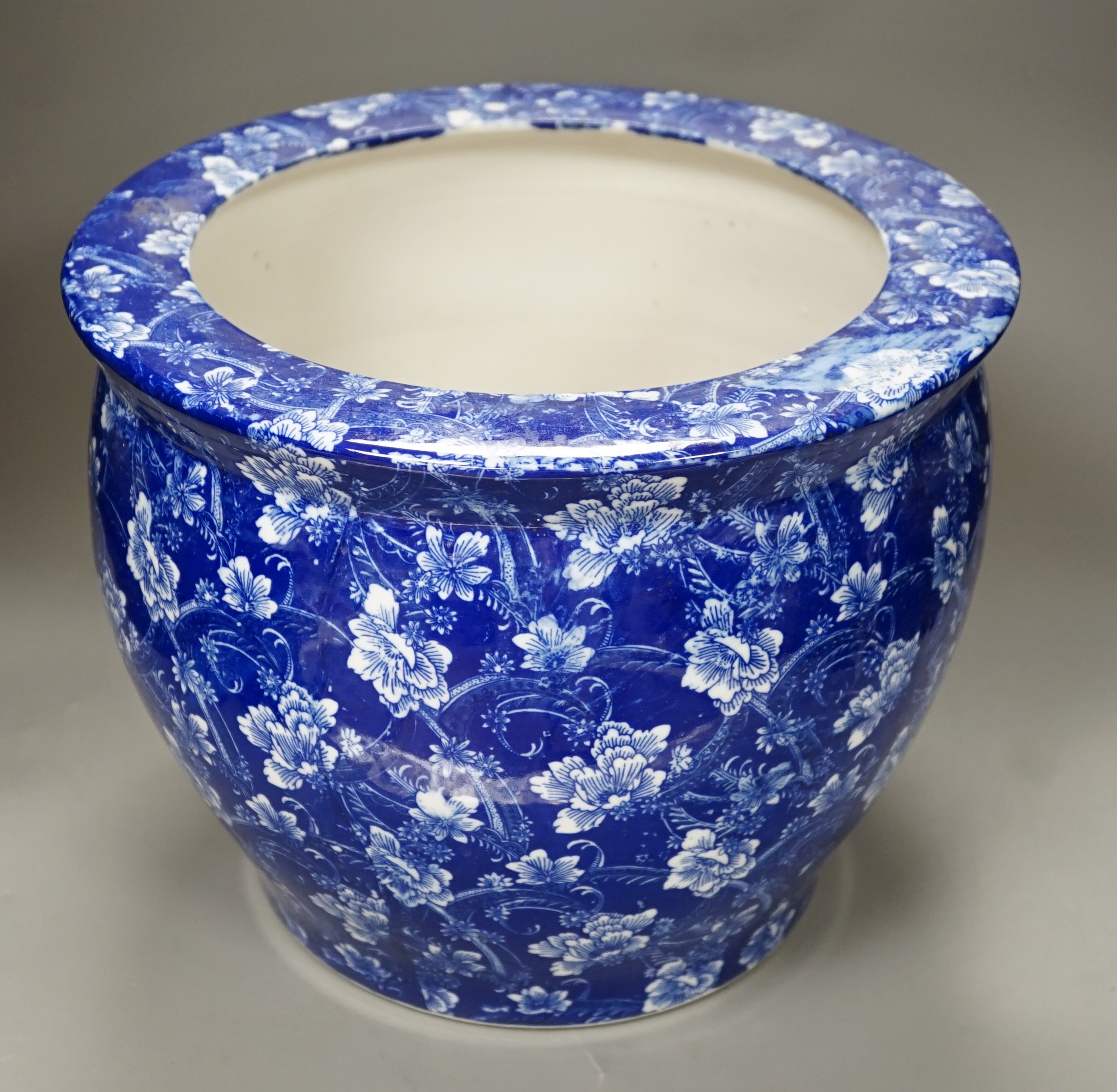 A blue and white ceramic jardiniere, pseudo mark, 27cm high.